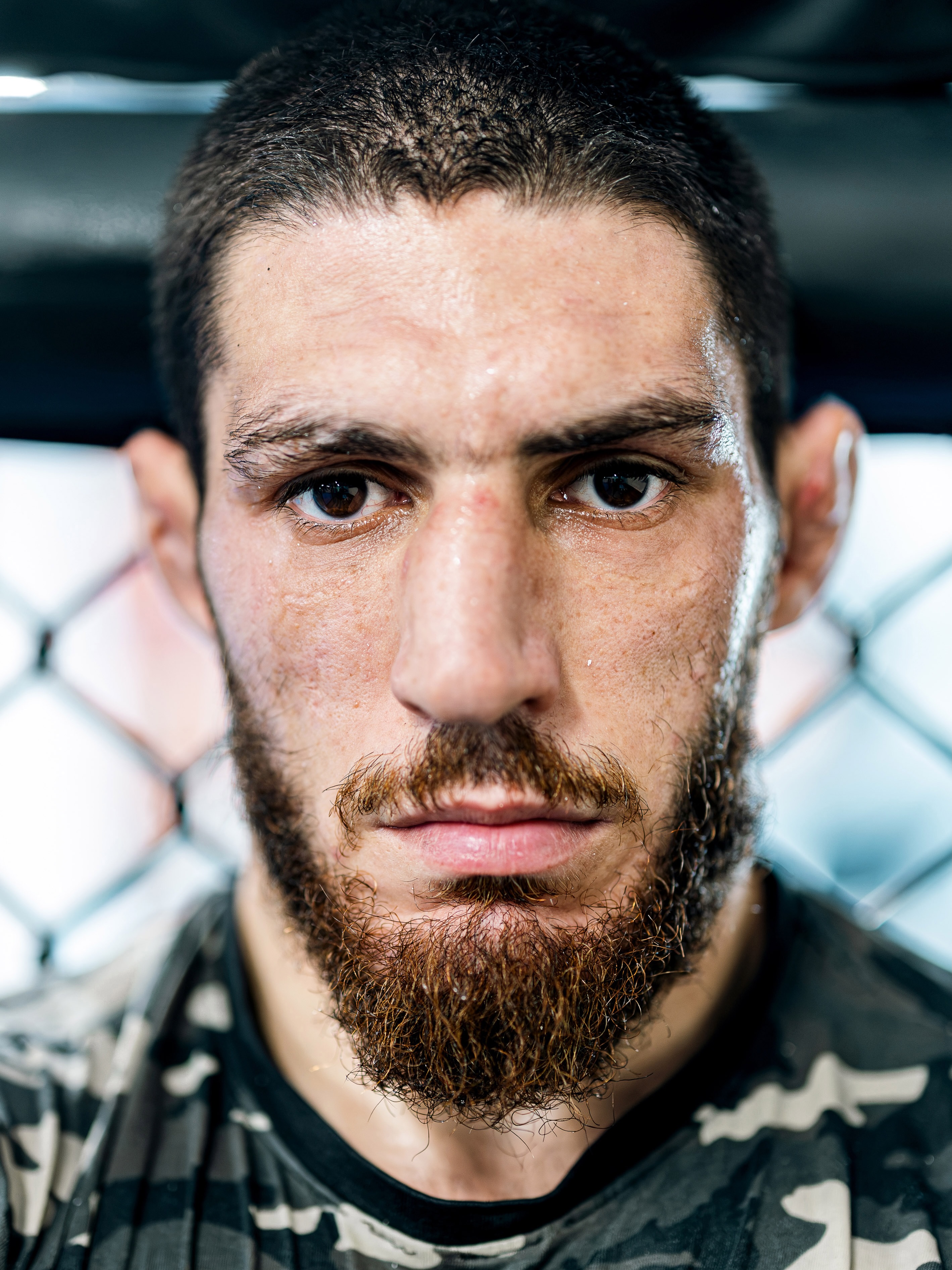 Michael Aljarouj intense close-up inside the cage