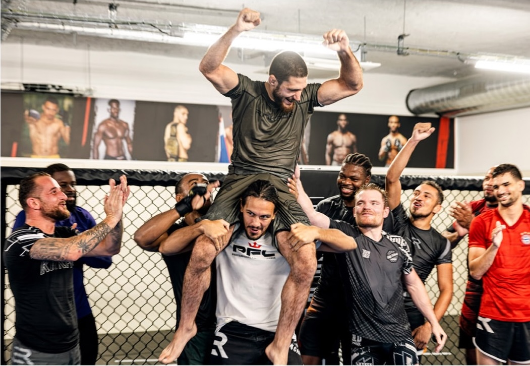 Michael Aljarouj carried in triumph by the OSA team after UFC signing